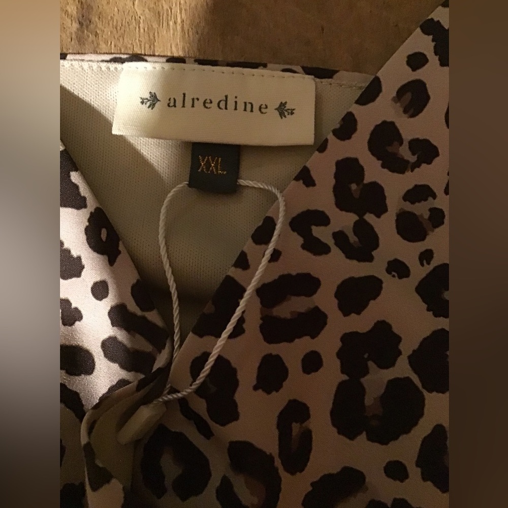 Alredine Cheetah Skater dress in great condition. Never worn but tags removed.